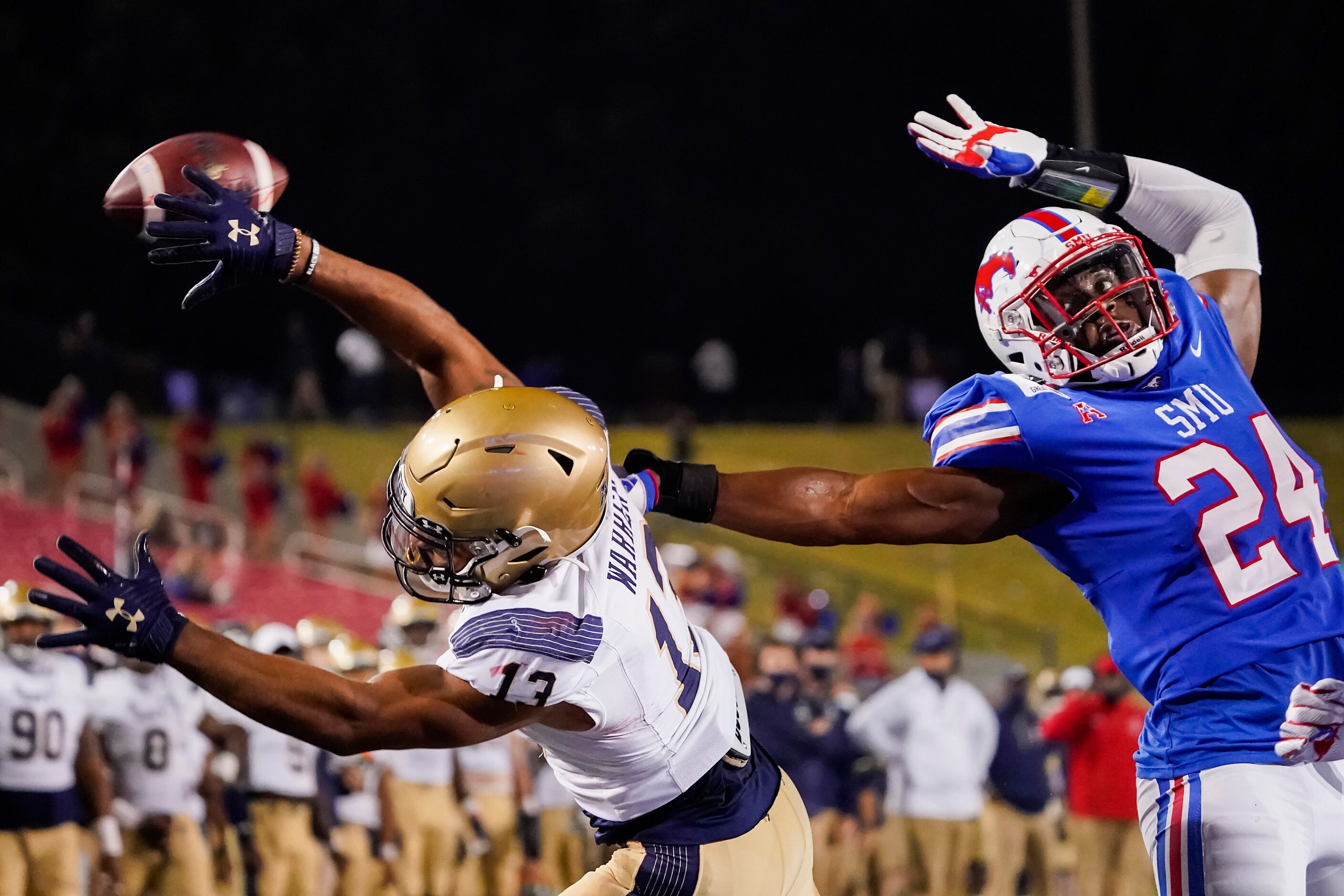 SMU linebacker Jimmy Phillips Jr. (24) breaks up a pass intended for Navy running back...