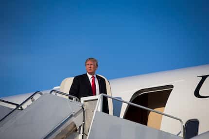 President Donald Trump boards Air Force One at Morristown Municipal Airport in Morristown,...