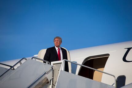 President Donald Trump boards Air Force One at Morristown Municipal Airport in Morristown,...