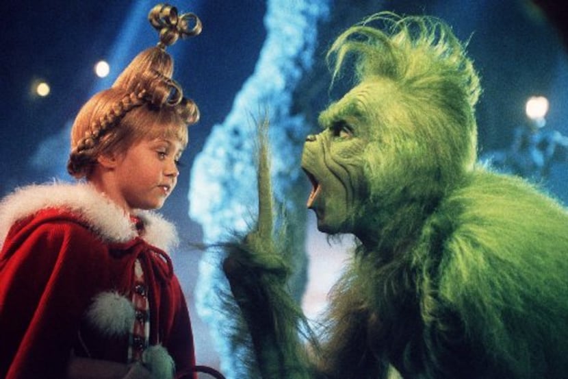 Taylor Momsen as Cindy Lou Who, left, shares a scene with the Grinch, played by Jim Carrey...