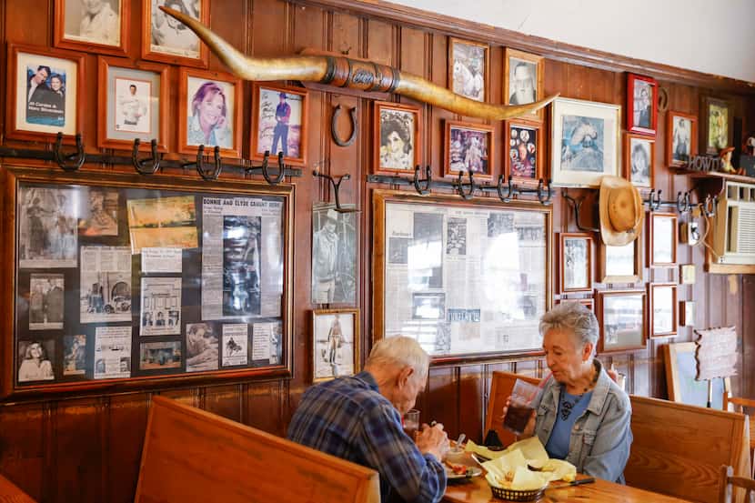Look close: The walls at Ranchman's Ponder Steakhouse are covered in news stories and...