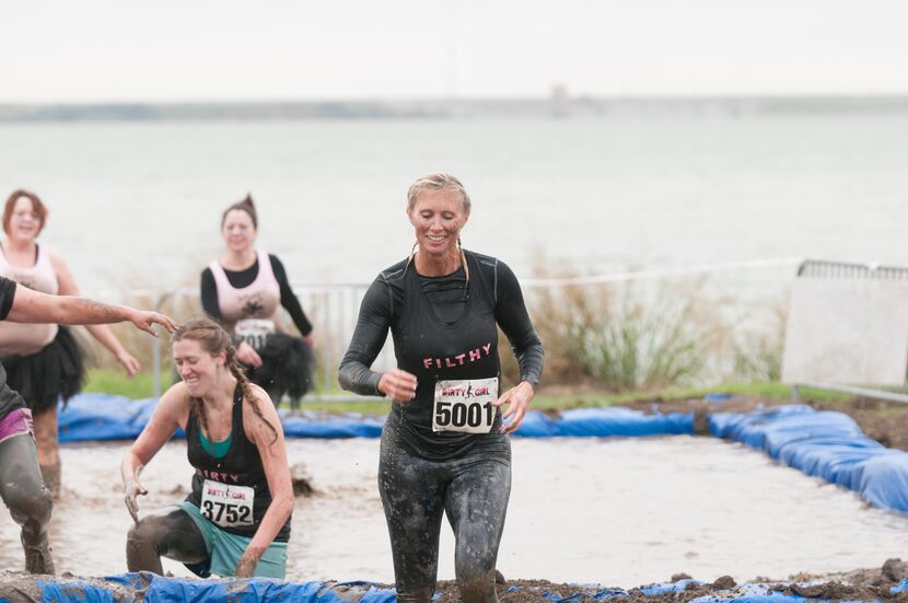 Women competing in the Dirty Girl Mud Run at Cedar Hill State Park on Saturday, Oct. 6,...