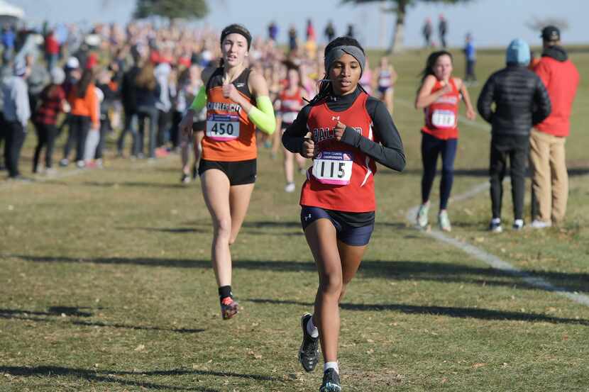 Ballard's Shewaye Johnson takes the lead at the beginning of the race during the Class 3A...
