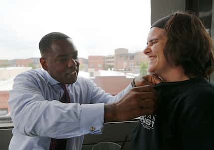 Plano Mayor Harry LaRosiliere pins a Plano pin on Brooke Arnold at Urban Crust in Plano on...