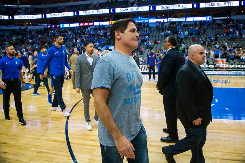 Dallas Mavericks owner Mark Cuban walks off the court following a 124-97 loss to the Phoenix...