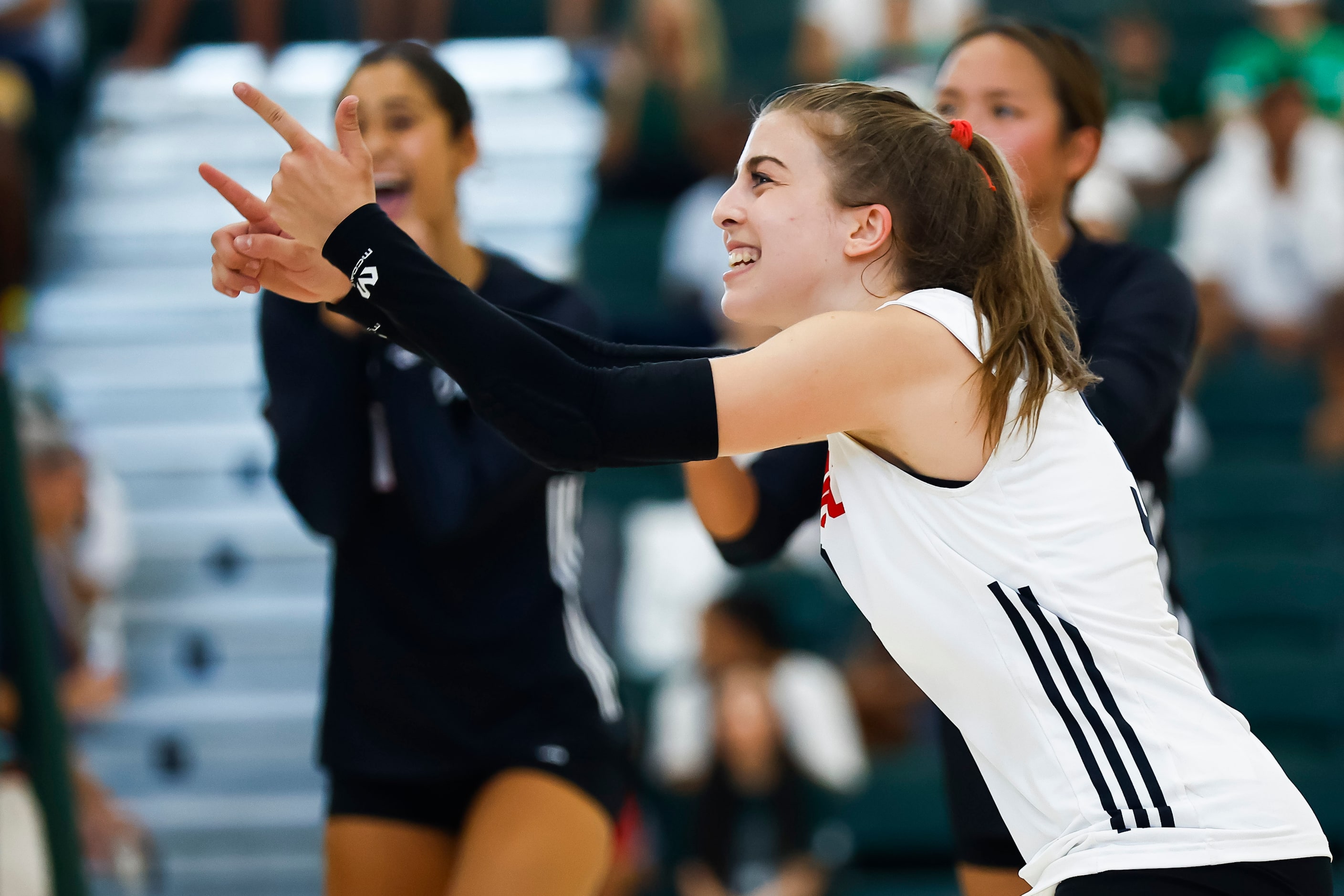 Love Joy senior libero McKenna Brand celebrates a point during a high school volleyball...