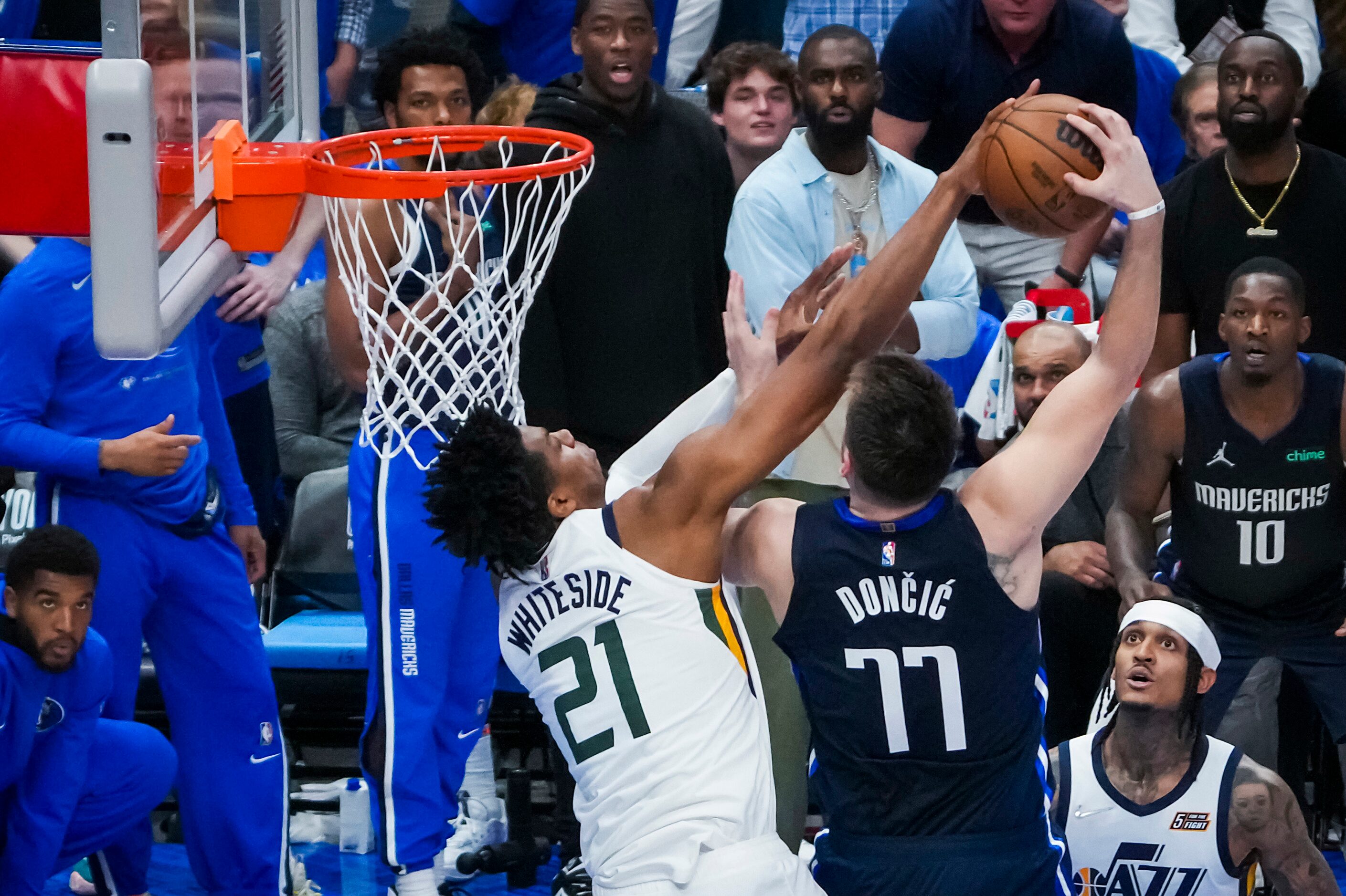 Dallas Mavericks guard Luka Doncic (77) is fouled by Utah Jazz center Hassan Whiteside (21)...