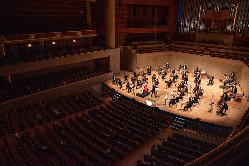 A crowd of under 100 DSO subscribers listen to harpist Emily Levin perform Ginastera's Harp...