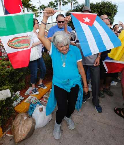 Cuban Americans celebrate in the streets of Miami's Little Havana the day after longtime...