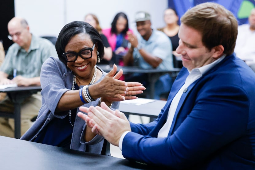 Dallas Mavericks CEO Cynthia Marshall (left) reacts towards governor and majority owner,...