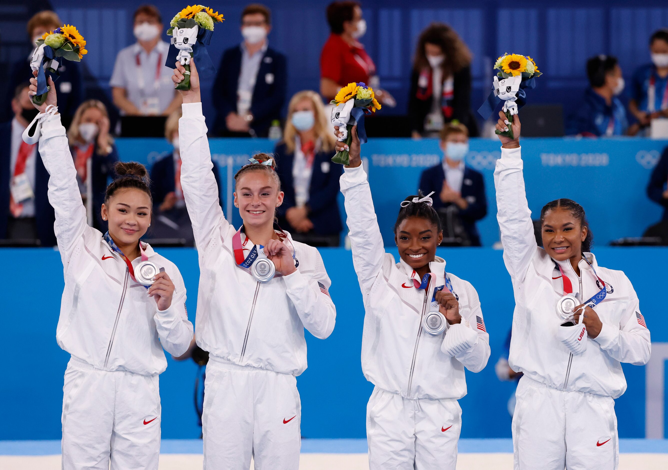 USA’s  Sunisa Lee, Grace McCallum, Simone Biles and Jordan Chiles after receiving their...