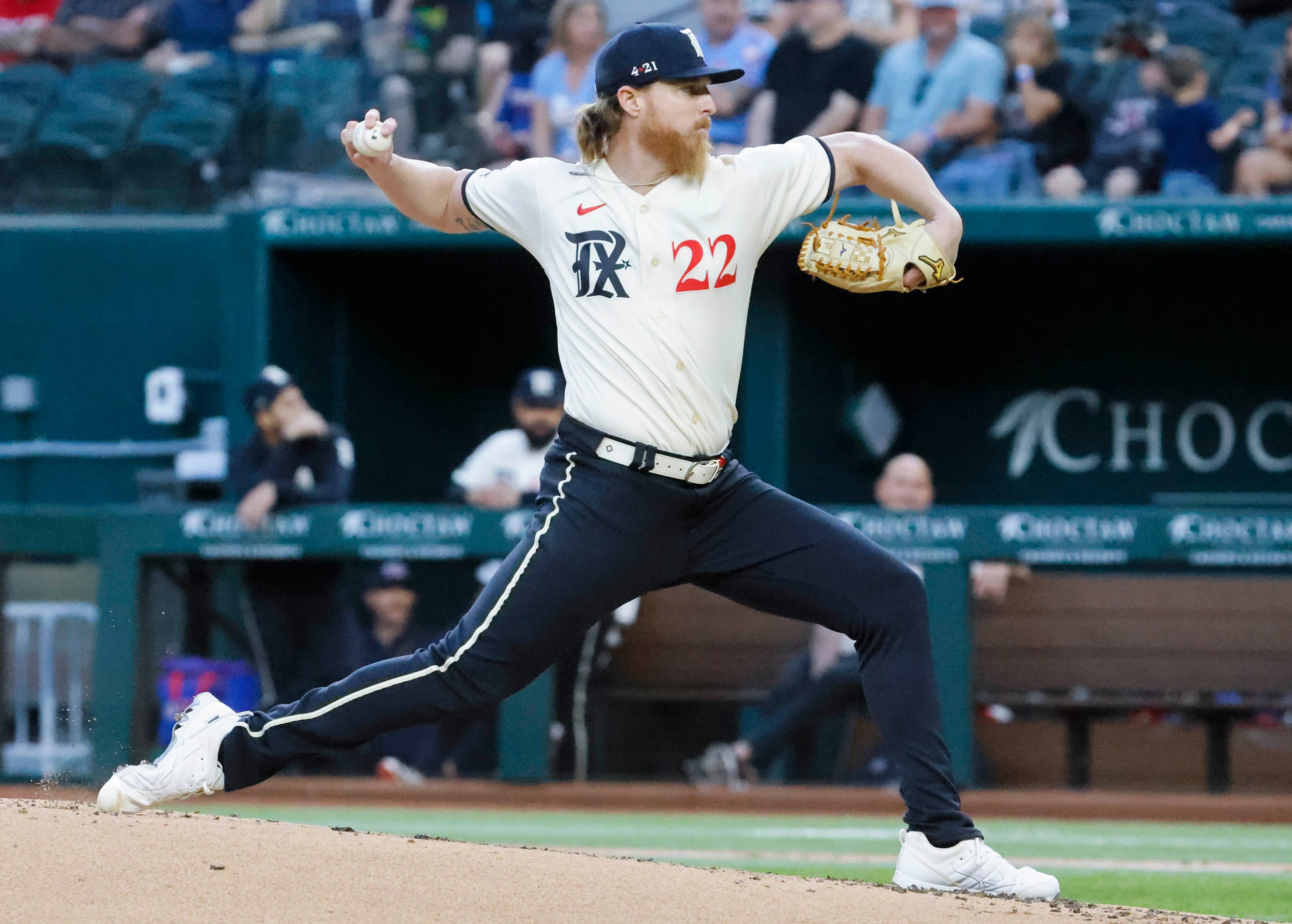 Texas Rangers starting pitcher Jon Gray throws during the first inning of a baseball game...