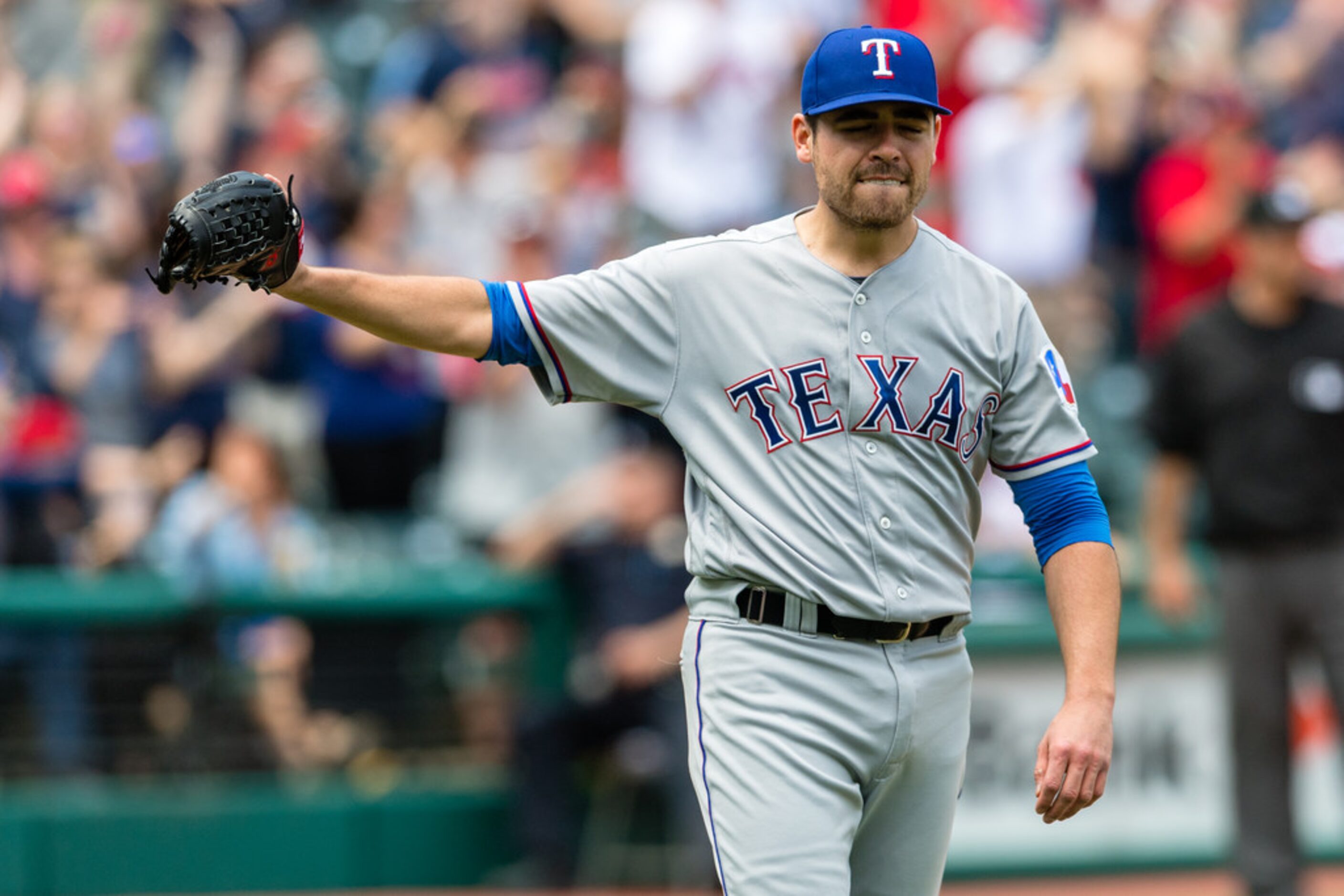 CLEVELAND, OH - MAY 2: Starting pitcher Matt Moore #55 of the Texas Rangers reacts after...