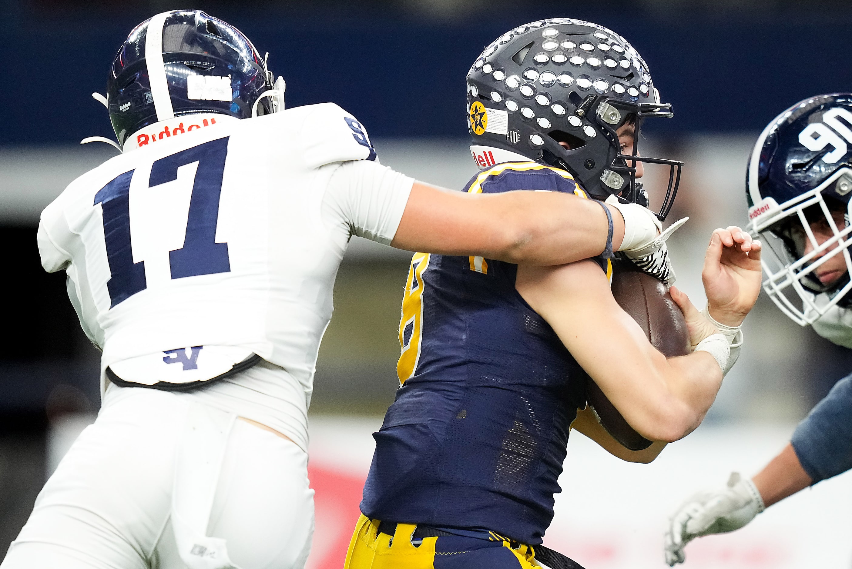 Highland Park quarterback Buck Randall (8) is sacked by Smithson Valley's Colton Hornsby...