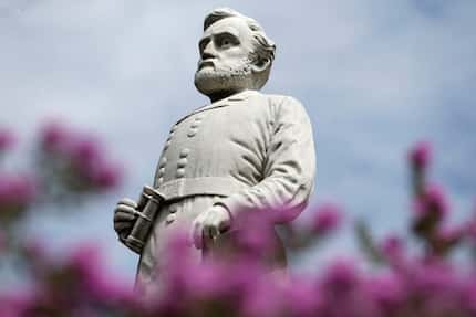 A statue of Gen. Robert E. Lee stands at the Confederate War Memorial in Dallas in September...
