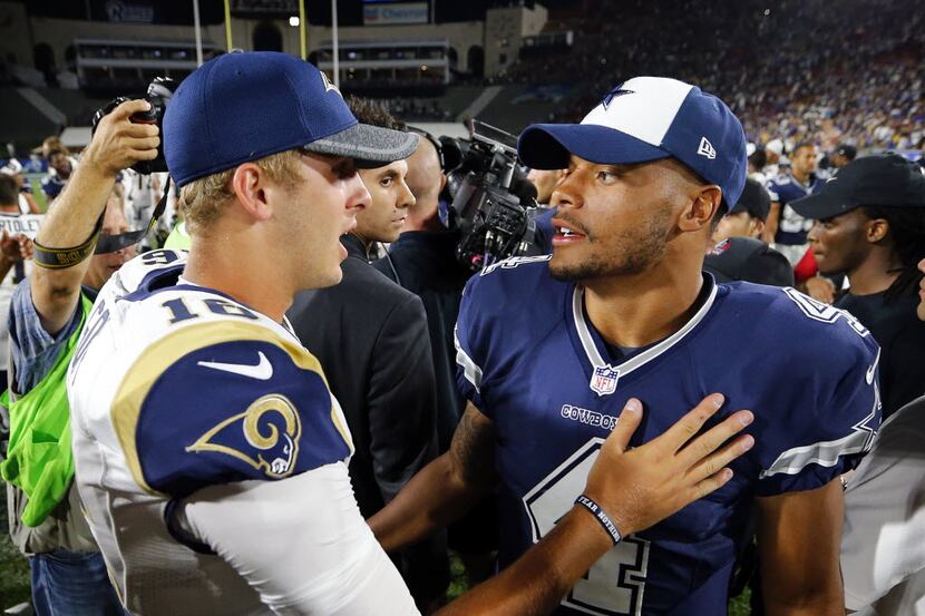 FILE - Cowboys quarterback Dak Prescott (4) and Rams quarterback Jared Goff (16) talk after...