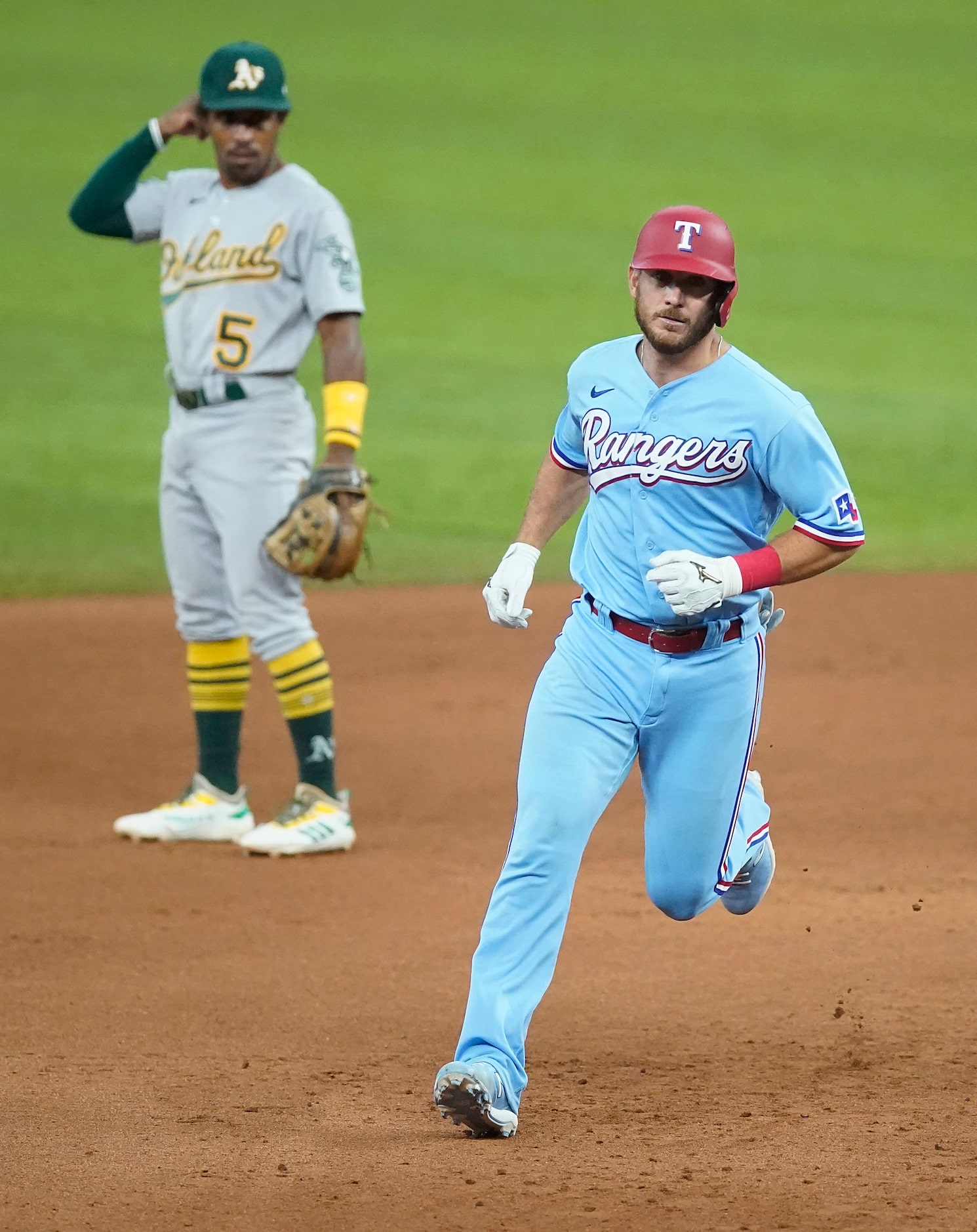 Texas Rangers catcher Jeff Mathis rounds the bases as Oakland Athletics second baseman Tony...