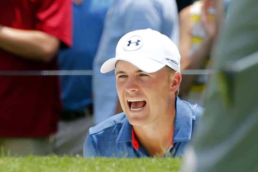 Jordan Spieth reacts to his bunker shot on the par-4, No. 5 during the final round of the...