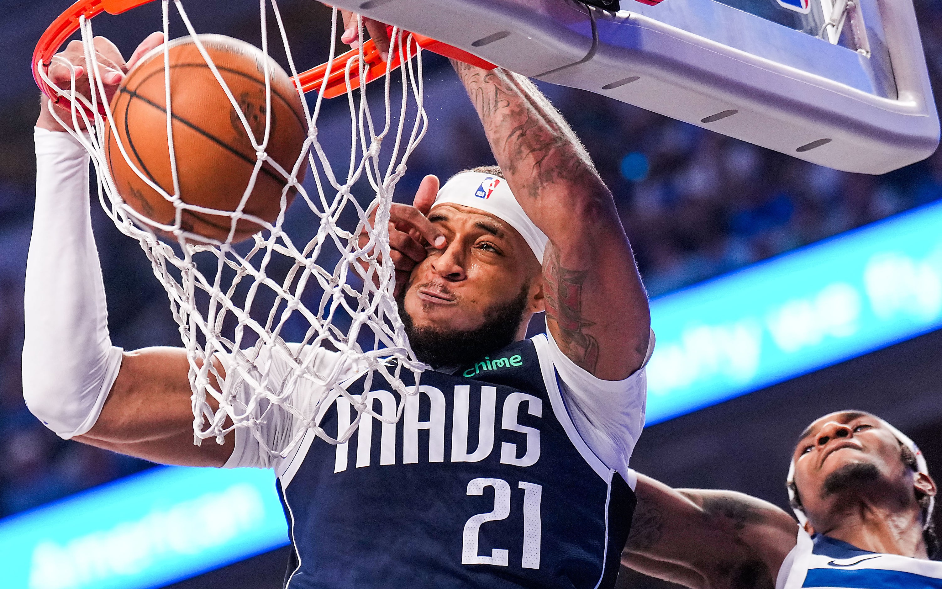 Dallas Mavericks center Daniel Gafford (21) dunks the ball past Minnesota Timberwolves...