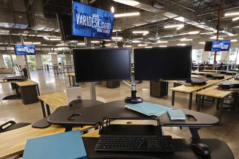 A Varidesk desk that allows you to stand or sit at the company's new headquarters in...