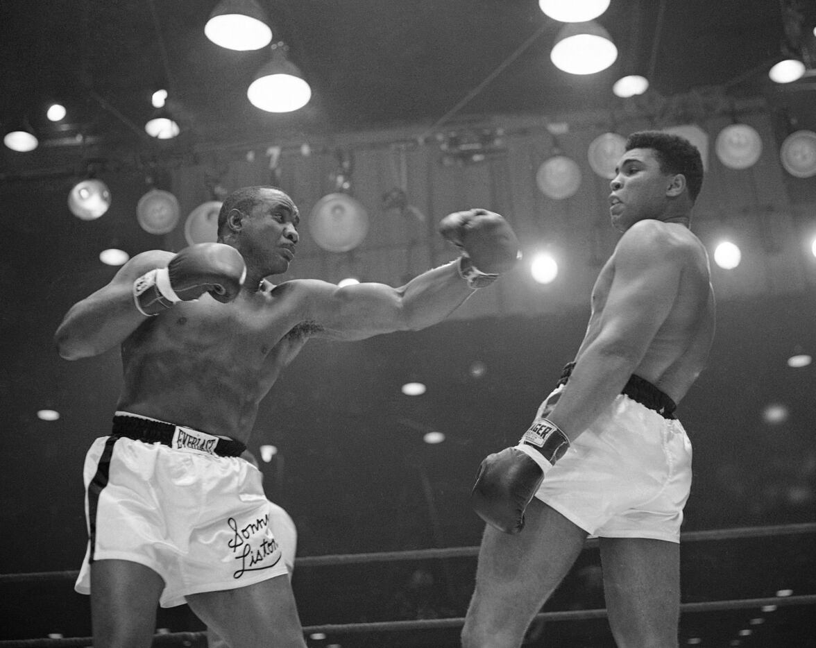 In this Feb. 26, 1964 file photo, Muhammad Ali (Cassius Clay)  uses a variety of bobbing and...