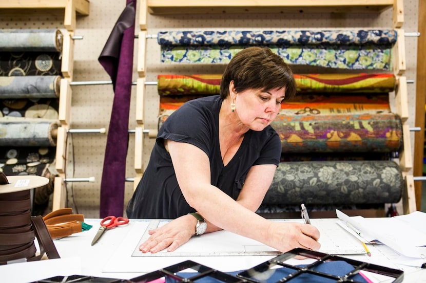 
Owner Sue Nordman works on a pattern at Erda Handbags. Her company reflects the trend of...