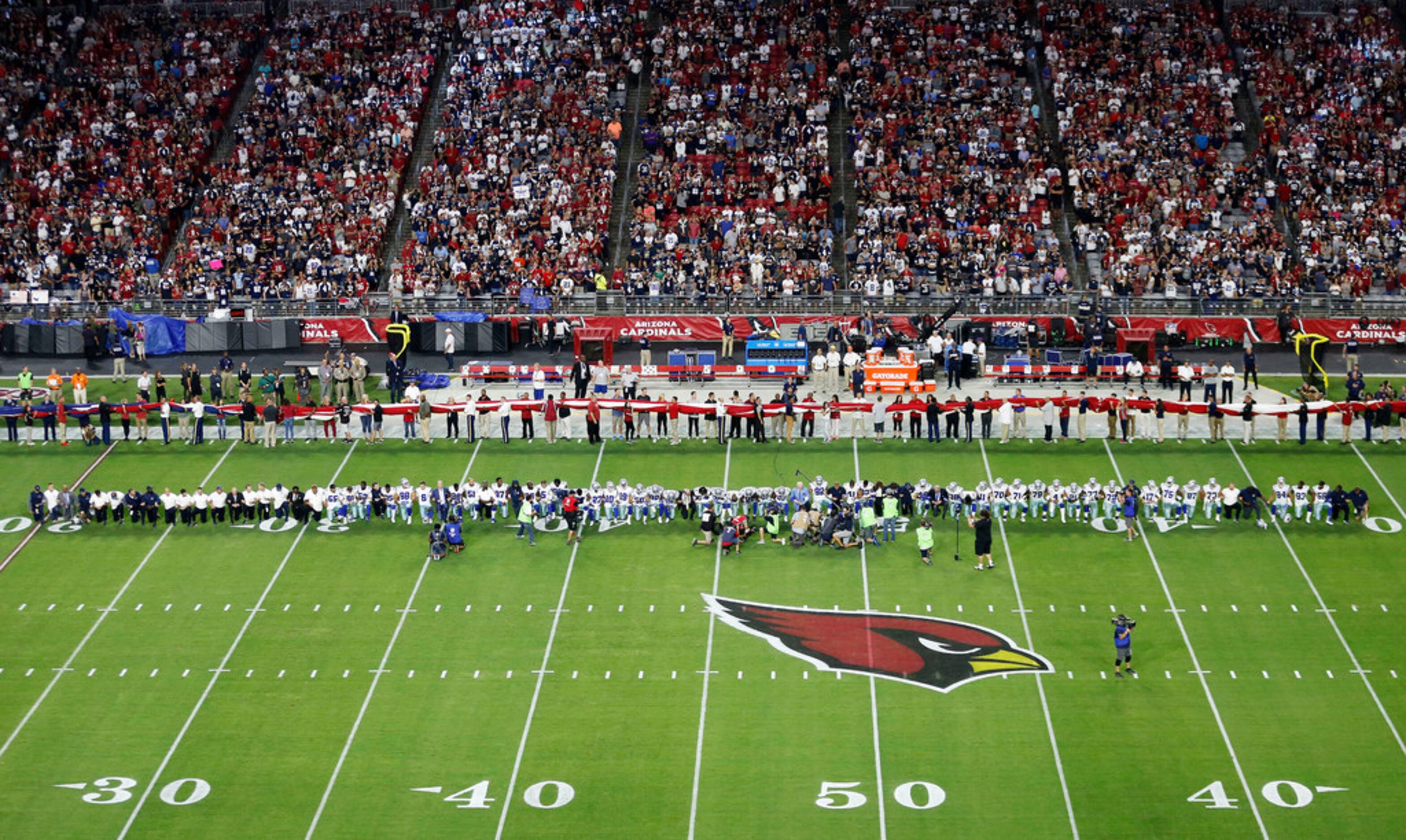 Cowboys owner Jerry Jones declines to comment on leaving his hat on during  national anthem