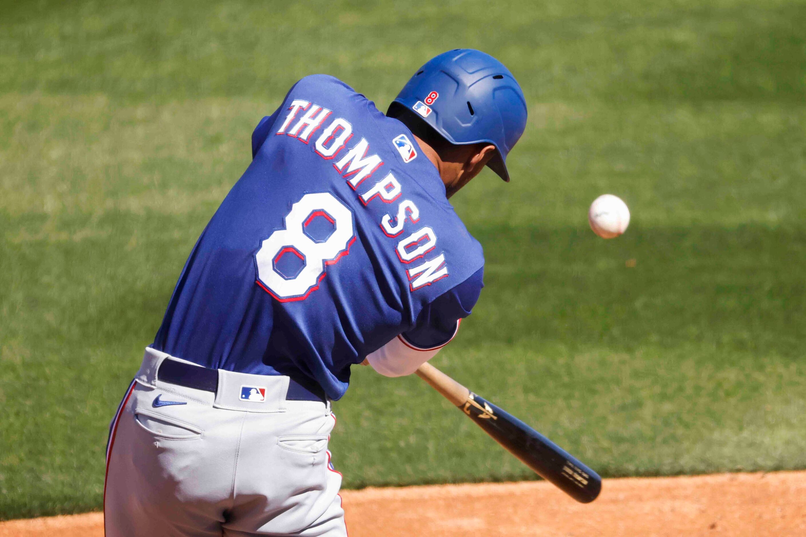 Texas Rangers Bubba Thompson bats during the third inning of a spring training game against...