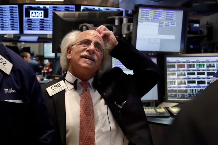 Trader Peter Tuchman works on the floor of the New York Stock Exchange, Monday, March 3,...