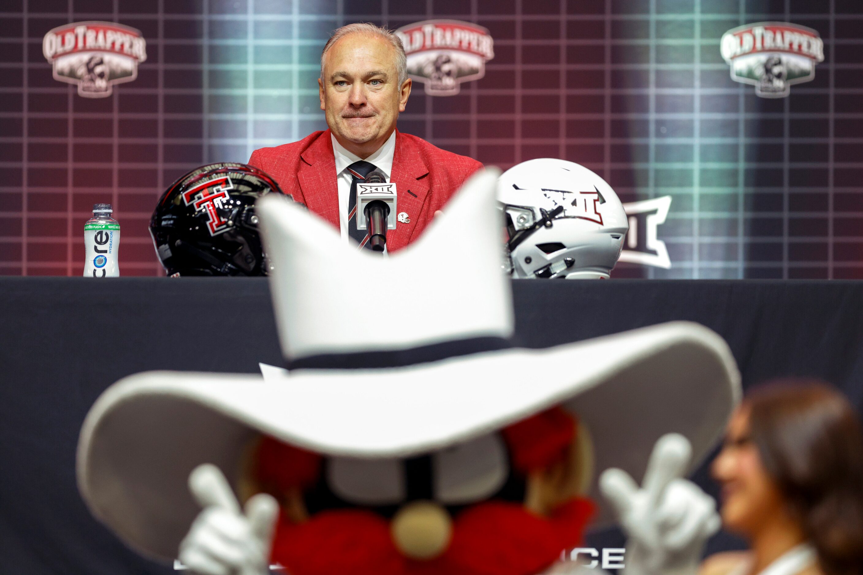 Texas Tech head coach Joey McGuire watches as Texas Tech mascot Raider Red cheers during the...