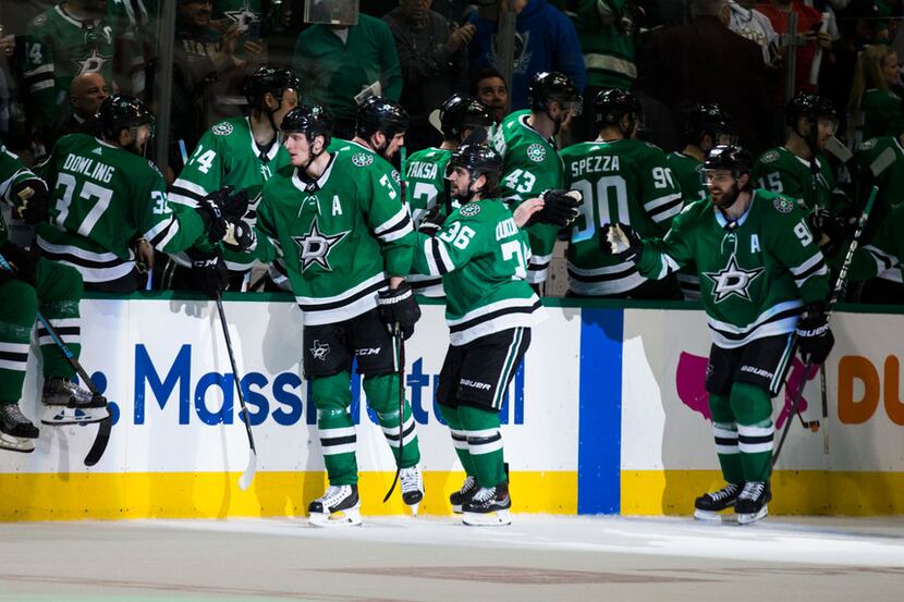 Dallas Stars celebrate a goal during the second period of Game 3 of a playoff series between...