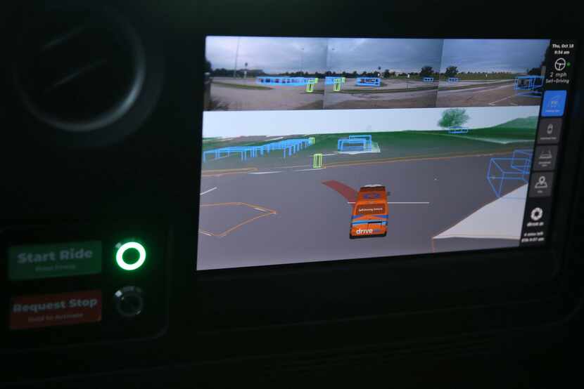 A display inside a Drive.ai self-driving vehicle shows what the vehicle sees. Pedestrians...