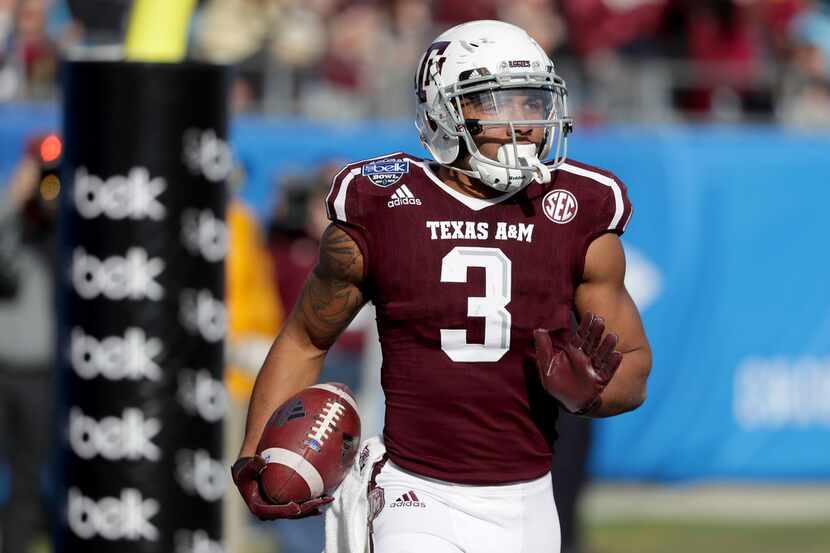 CHARLOTTE, NC - DECEMBER 29:  Christian Kirk #3 of the Texas A&M Aggies catches a touchdown...