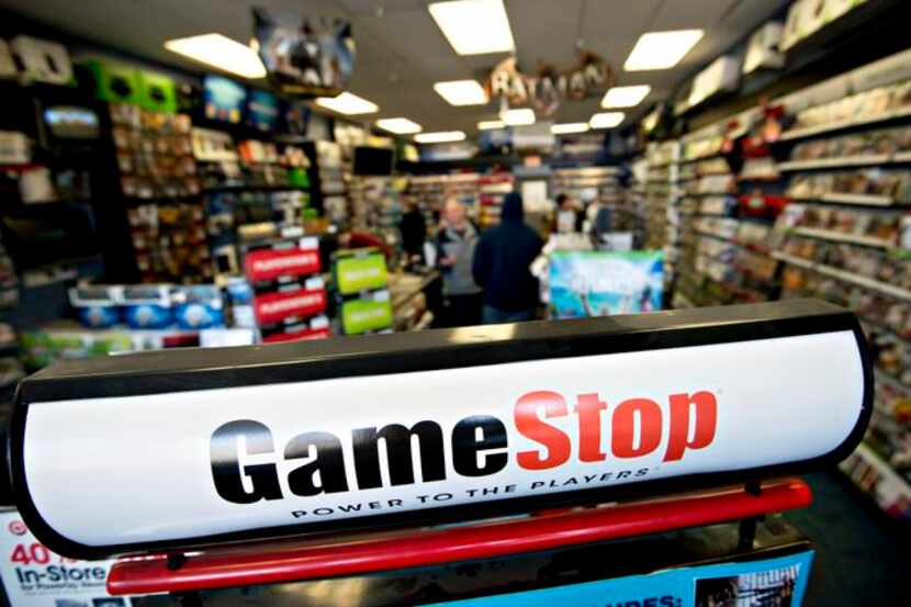 Signage stands in a GameStop Corp. store in Peru, Illinois, U.S., on Wednesday, March 26,...