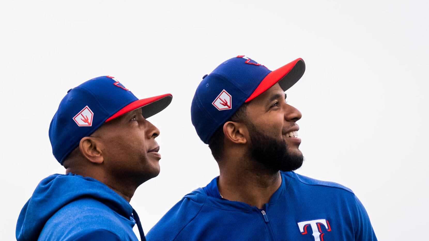 Texas Rangers shortstop Elvis Andrus (right) and third base coach Tony Beasley look to the...