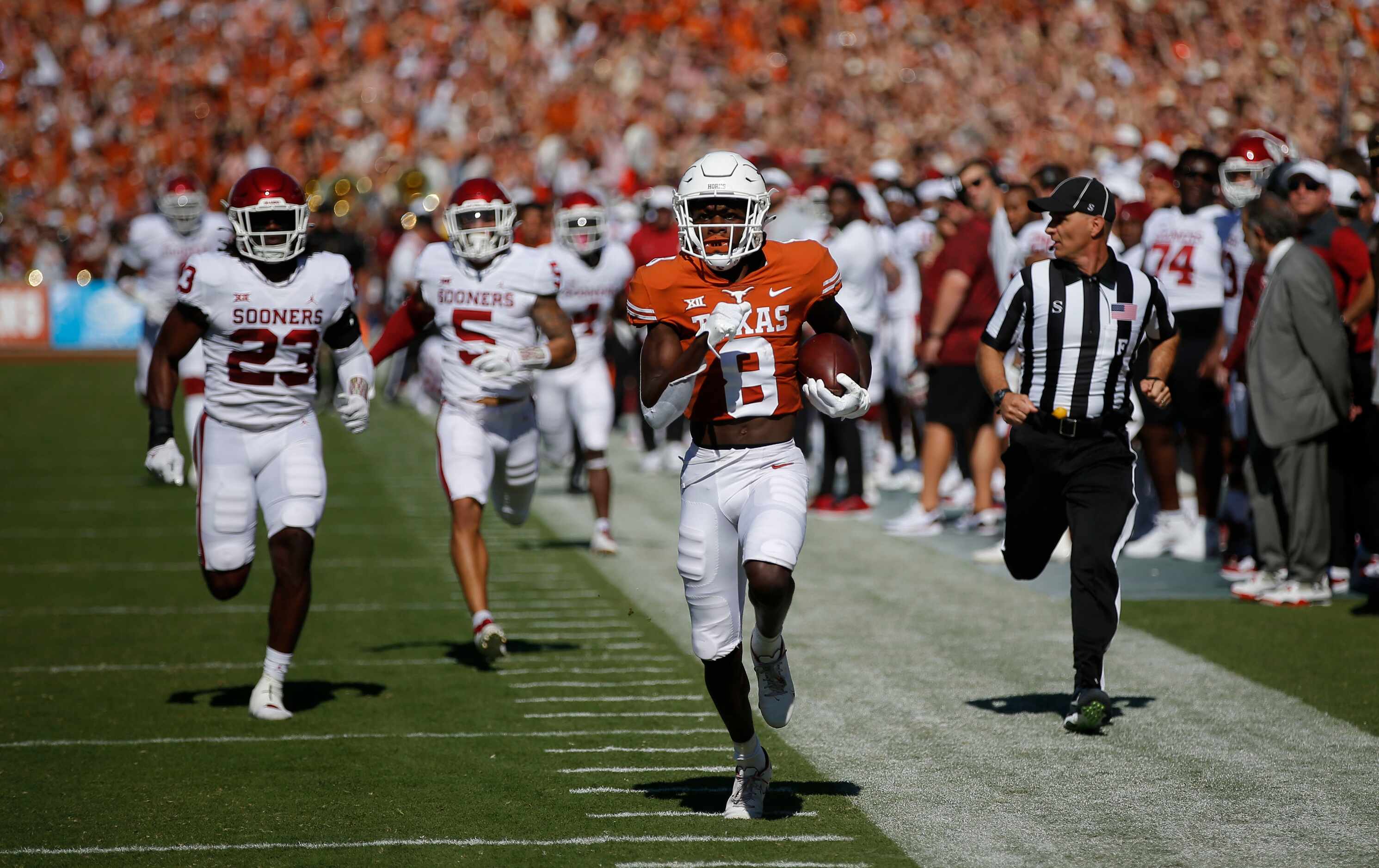 Texas wide receiver Xavier Worthy (8) breaks past the Oklahoma defense to score a touchdown...
