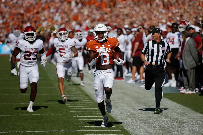 Texas wide receiver Xavier Worthy (8) breaks past the Oklahoma defense to score a touchdown...