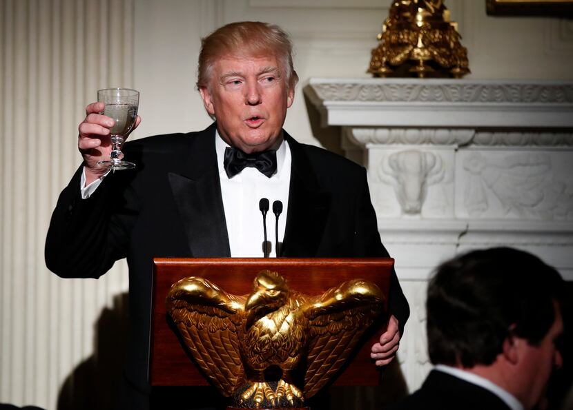 Host President Donald Trump, makes a toast during a dinner reception for the annual National...
