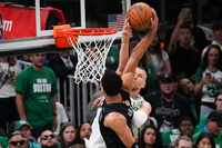 Boston Celtics center Kristaps Porzingis (8) blocks a shot by Dallas Mavericks guard Josh...