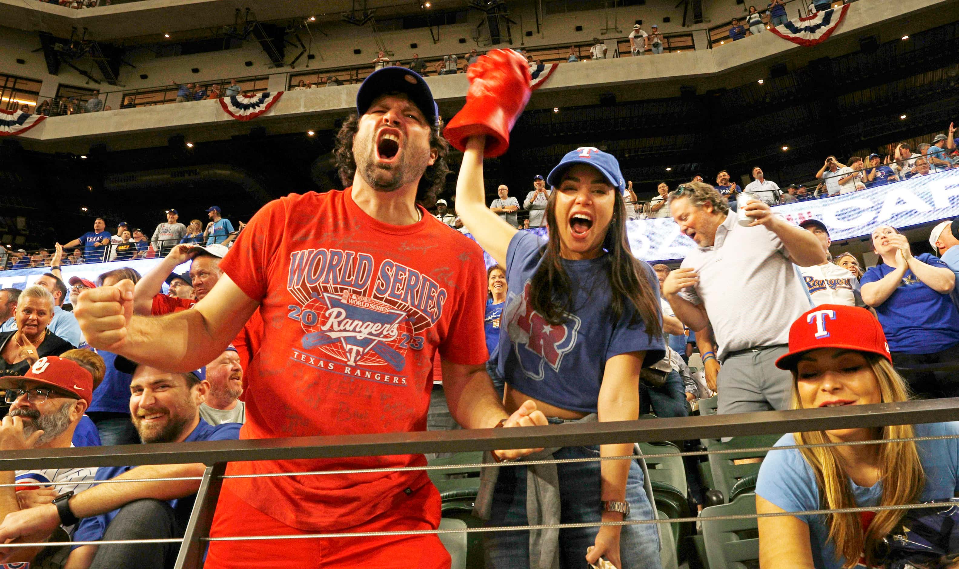 Texas Rangers fans react after Texas Rangers left fielder Travis Jankowski hit a home run...