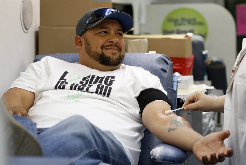 In this file photo, Justin Jenkins prepares to give blood at a Carter BloodCare drive he...