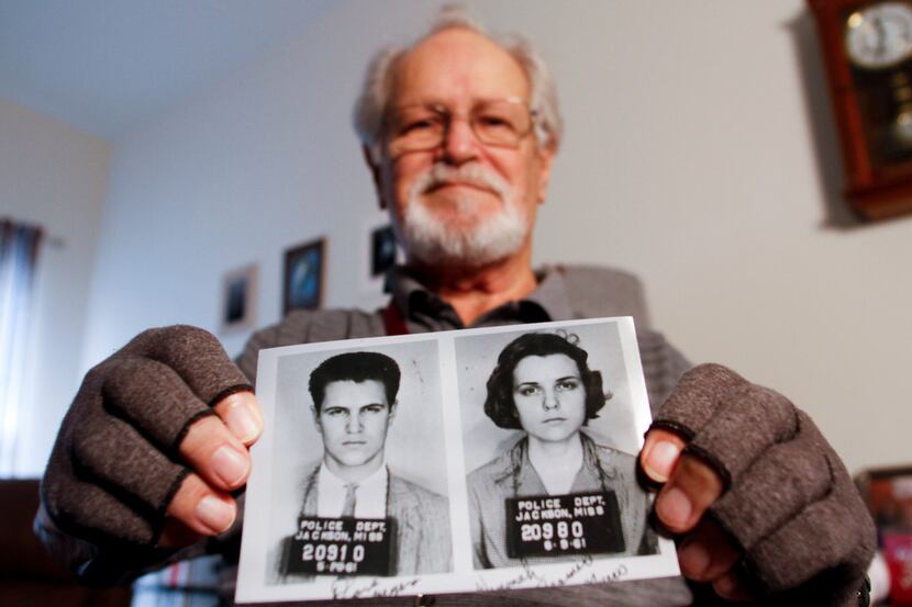 David Myers holds a copy of the booking photos of himself and his then-girlfriend, Winonah...