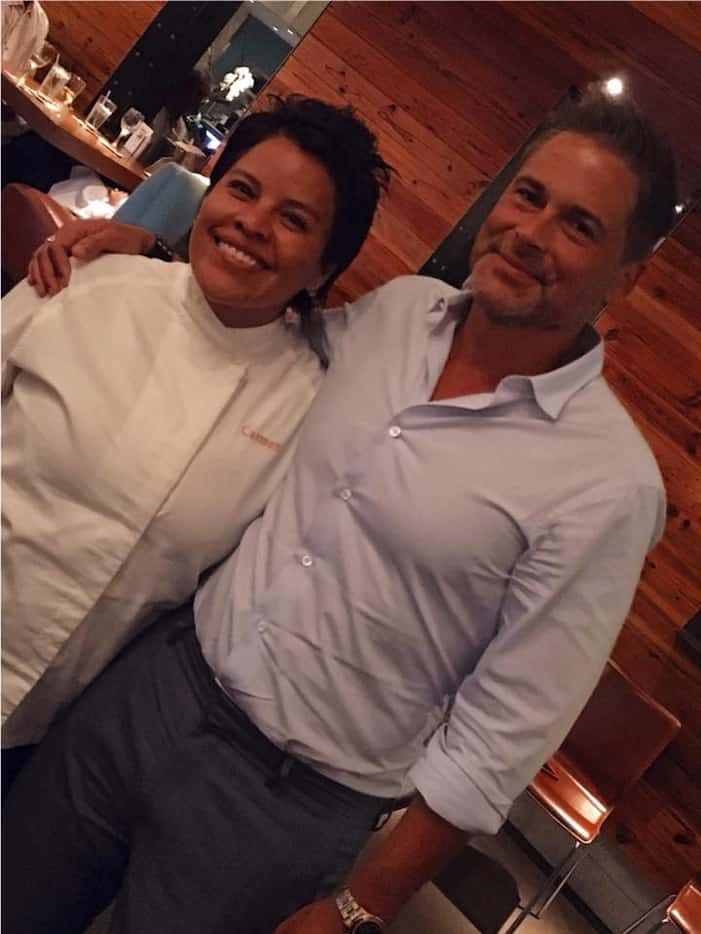Rob Lowe cheerfully poses for pictures at Mesero Inwood Village with store director Carmen...
