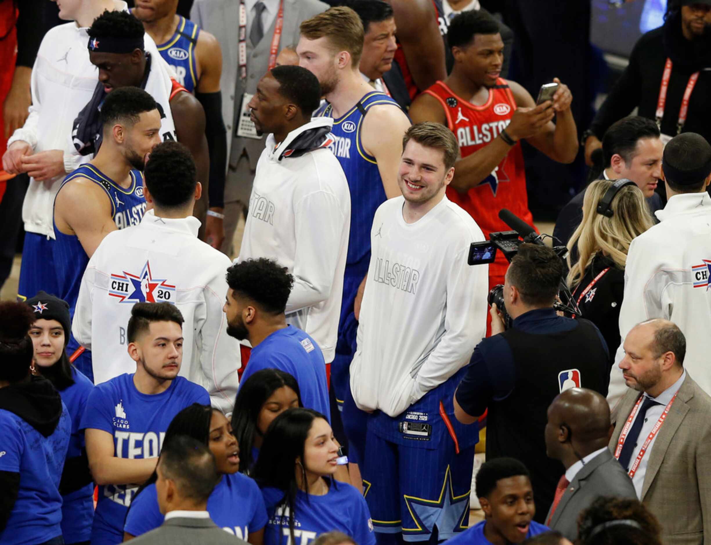 Team LeBron's Luka Doncic (2) smiles as his team celebrates after defeating Team Giannis...