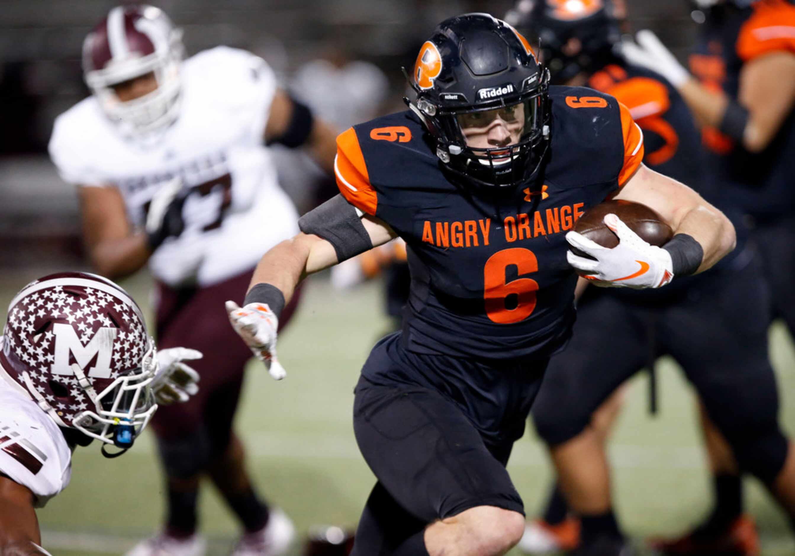 Rockwall RB Zack Henry (6) punches his way through the Mesquite defense for a long gain to...