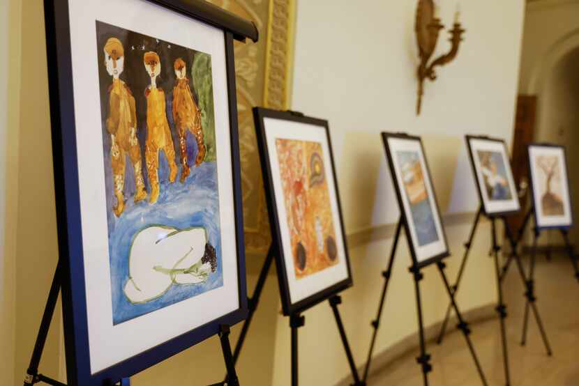 Replica paintings done by "comfort women," survivors are displayed during a panel discussion...