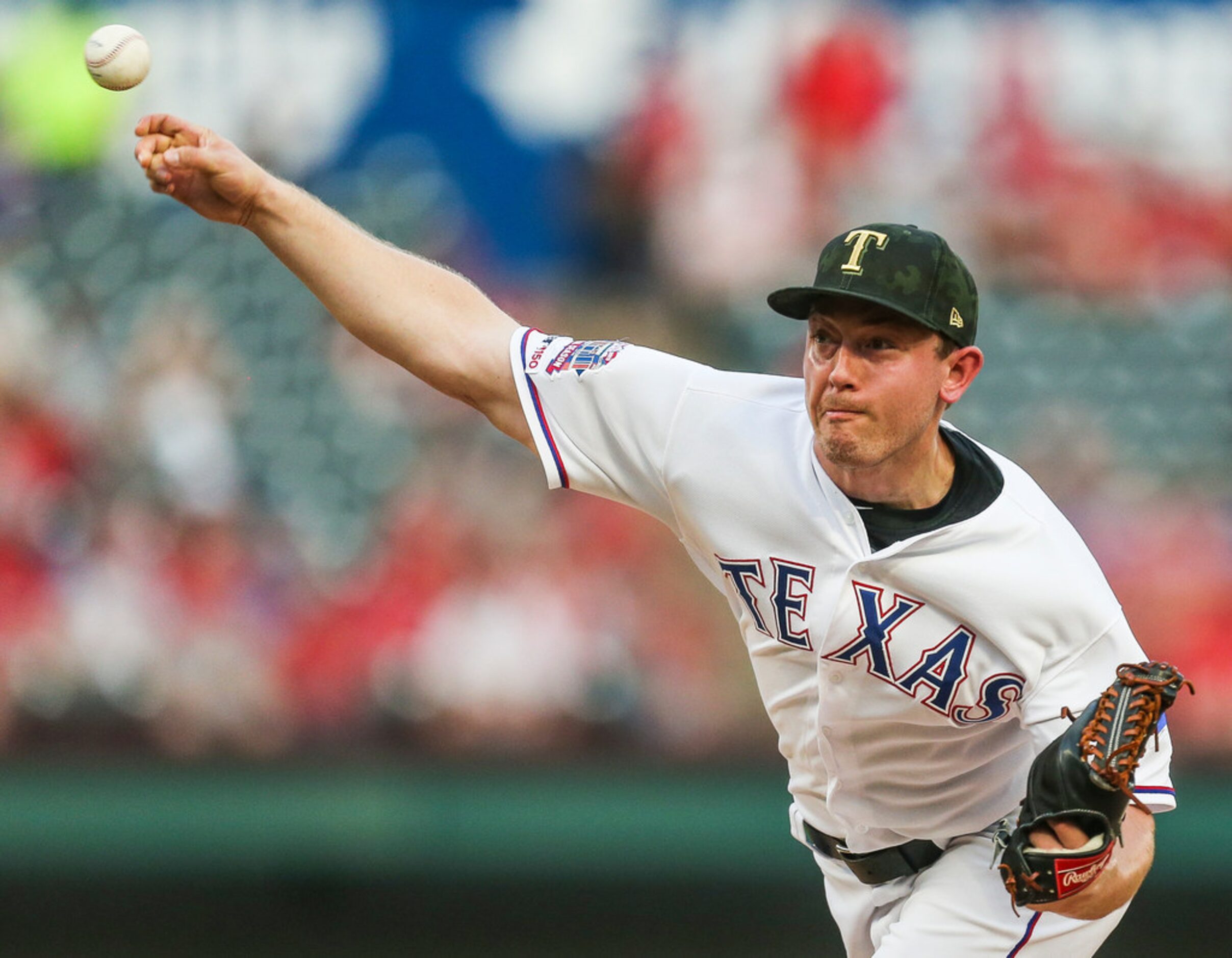 Texas Rangers starting pitcher Adrian Sampson (52) pitches during the top of the second...