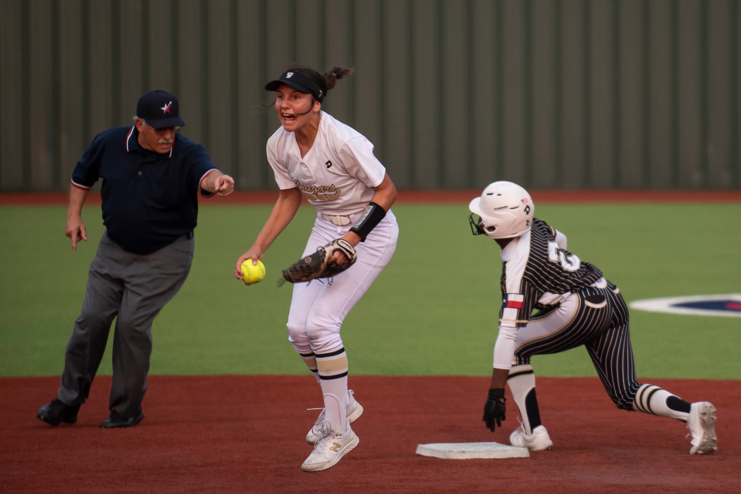 The Colony’s Sabrina Wick (7) exclaims after tagging Royse City’s Lacey Hicks (2) out after...