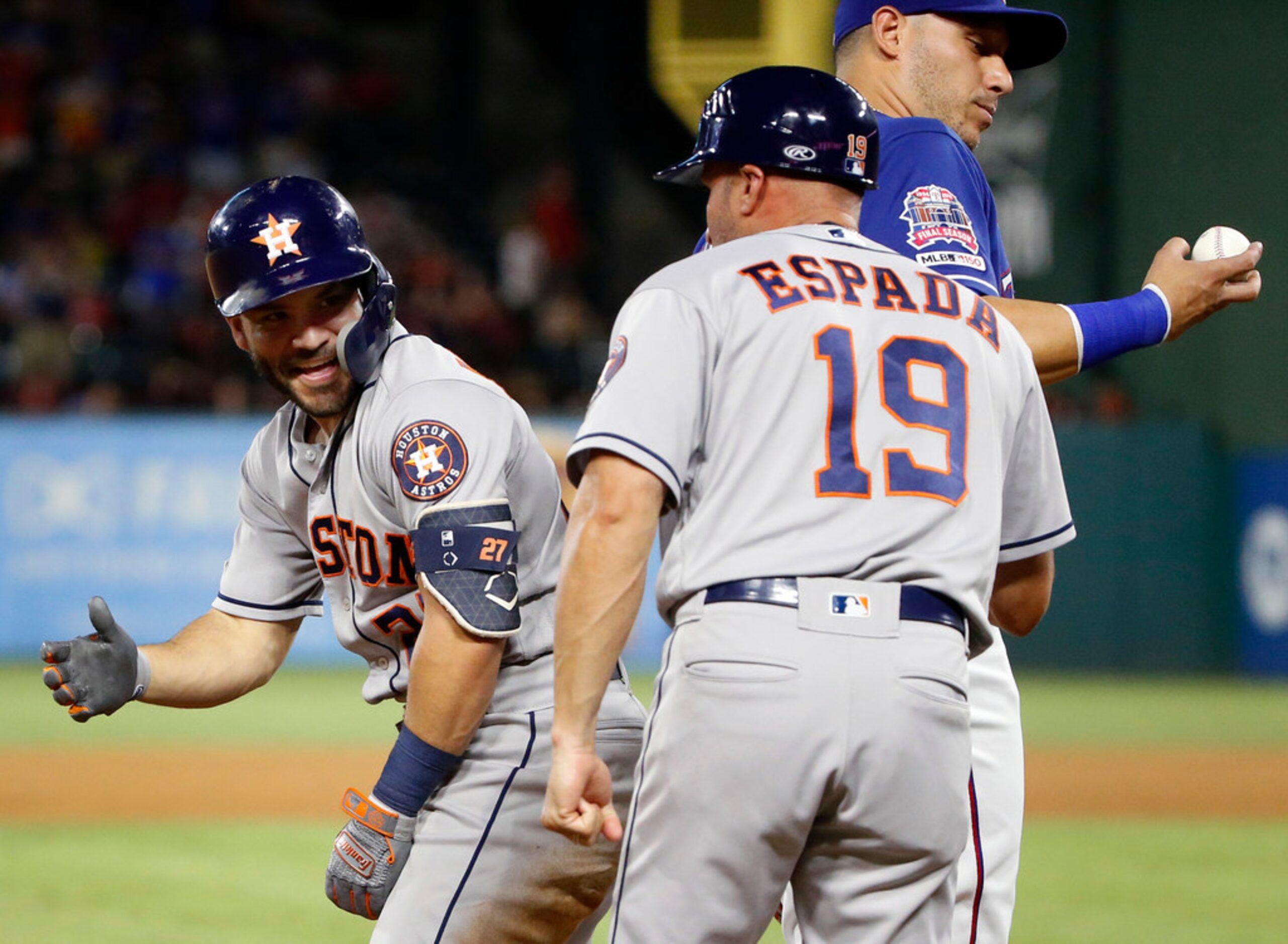 Houston Astros second baseman Jose Altuve (27) celebrates with bench coach Joe Espada (19)...