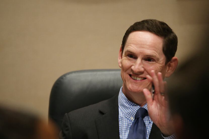 Dallas County judge Clay Jenkins waves to an attendee during a Dallas County Commissioners...